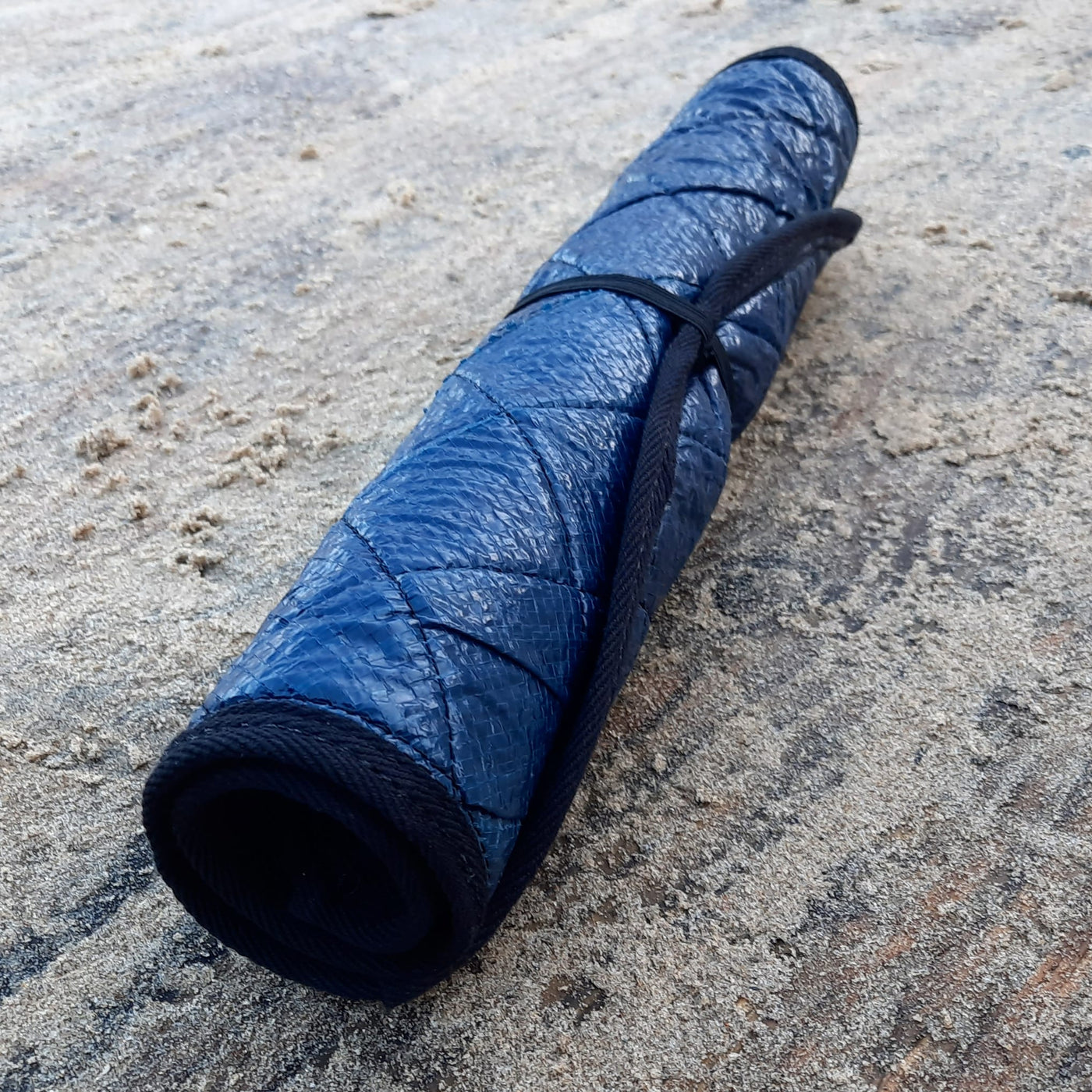 A rolled up changing mat